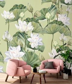 two pink chairs sitting next to each other in front of a wall mural