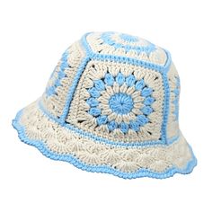 a white and blue crocheted hat on a white background