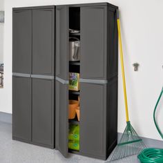 a large gray storage cabinet next to a garden hose and watering can on the floor