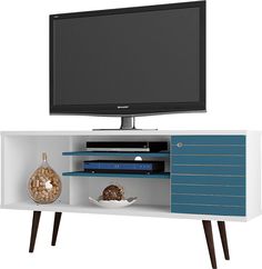 an entertainment center with a flat screen tv on it's side and shelves below