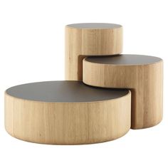 three circular wooden tables stacked on top of each other