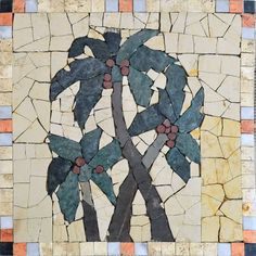 a mosaic tile wall with a palm tree on it