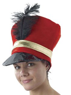 a woman wearing a red hat with black feathers