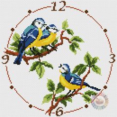 two birds sitting on top of a tree branch in front of a cross stitch pattern