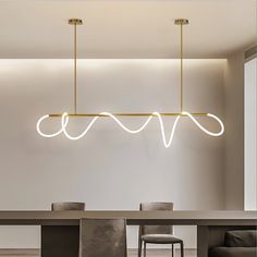 an elegant dining room with modern lighting fixtures