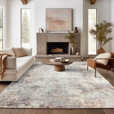 a living room filled with furniture and a fire place in the middle of the room