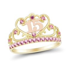 Surprise your princess on her special day with this sweet pink lab-created sapphire "15" crown ring. 10K two-toned gold Pink lab-created sapphires adorn the yellow gold band and the open-worked crown design The number "15" is sculpted in rose gold inside the heart-shaped center detail Quince Ring And Necklace, Pink Quince Ring, 15 Quinceanera Ring, 15 Rings Quinceanera, Yellow Gold Crown Promise Ring, Pink And Gold Quince Crown, Sweet 16 Jewelry, Quince Jewelry, Crown Rings