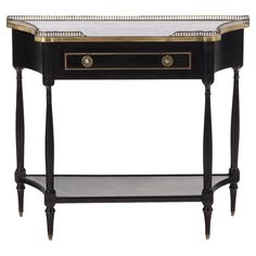 a black and gold console table with marble top