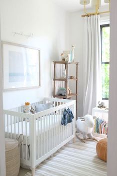 a baby's room with a white crib and bookshelf