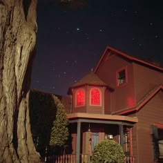 the house is lit up with red lights