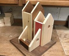 three pieces of wood sitting on top of a table