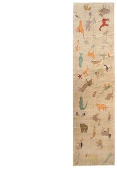 an old rug with cats and other animals on it, hanging from the wall in front of a white background