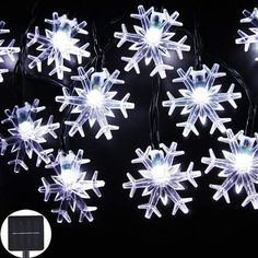 snowflake lights are shown on a black background