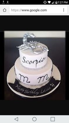 a three tiered cake with the words sopi and m on it