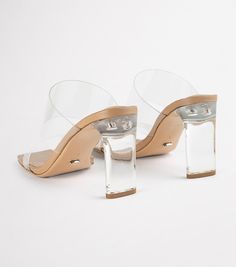 Shine bright in our Chicago heels. A classic mule to take you from day to night, featuring a see-through vinylite upper with an on-trend squared toe-shape and a mid-height heel. -Material: Synthetic Upper & Leather Lining -Sole: Resin -Fit: True to size -Toe-shape: Squared -Features: Two-strap upper -Heel: 8.5cm “WARNING: This product contains chemicals known to the State of California to cause cancer and/or reproductive harm. For more information, visit Visit W3Schools.com!www.P65Warnings.ca.go Shop Heels, Thigh High Boots Flat, Embellished Heels, Heels Online, Metallic Shoes, Bridal Heels, Tony Bianco, Metallic Heels, Bow Heels