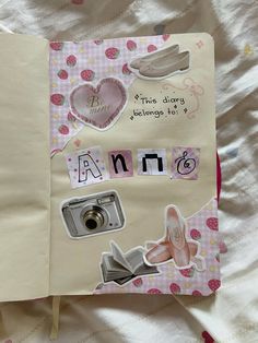 an open notebook with stickers and pictures on the pages that say i love you