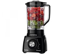 a black blender filled with lots of fruit