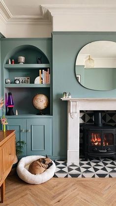 a living room filled with furniture and a fire place