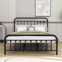 a black metal bed frame in a bedroom