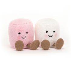 two small stuffed animals sitting next to each other on a white surface, one is pink and the other has brown feet