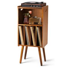 an old fashioned record player is in a wooden cabinet