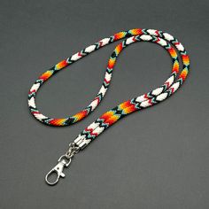 a multicolored dog leash on a gray background