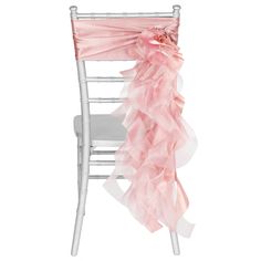 a chair with a pink ruffled sash on it