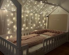 a bed that has some lights on it