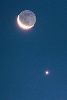 the moon and venus are visible in the sky