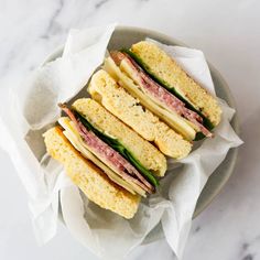 a plate with sandwiches on it sitting on top of a table