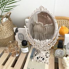 a mirror sitting on top of a wooden table