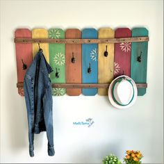 the coat rack is made out of wooden boards