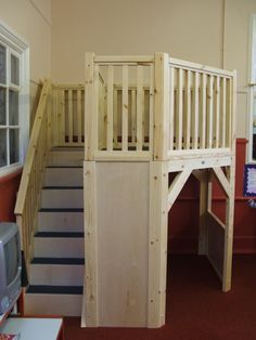 the stairs are made from wood and have been built into the wall to allow children to climb