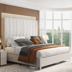 a bedroom with a bed, nightstands and large windows