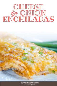 chicken and onion enchiladas on a plate with green beans