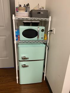 a microwave oven sitting on top of a shelf