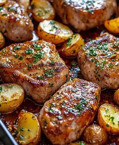 some meat and potatoes in a pan with seasoning on top for garnish