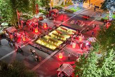 an aerial view of a city square at night