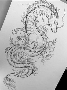 a drawing of a dragon with flowers on it