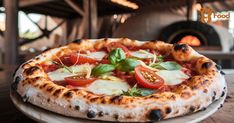 a pizza sitting on top of a white plate covered in cheese and toppings next to a wood burning oven