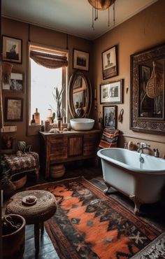 an old fashioned bathtub is in the middle of a room with pictures on the wall