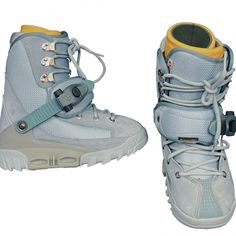 a pair of snowboard boots with laces and straps on the bottom, side by side