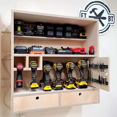 a shelf filled with lots of tools on top of a wooden cabinet next to a wall