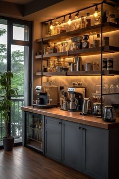 a coffee bar with lots of pots and pans on the shelves next to a window