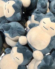 a pile of blue and white teddy bears sitting next to each other