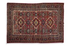 an antique persian rug with red and blue colors