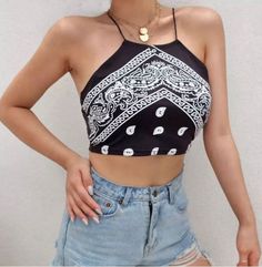 Elevate your style with our cute black print bandana-style cropped top! This versatile piece is perfect for both casual wear and a night out on the town. Chic Printed Summer Crop Top, Trendy Black Festival Tops, Trendy Black Tops For Festival, Trendy Tops For Summer Night Out, Edgy Cotton Crop Top For Night Out, Graphic Print Crop Top For Spring Party, Trendy Fitted Crop Top For Festivals, Trendy Summer Tops For Night Out, Printed Fitted Crop Top For Summer