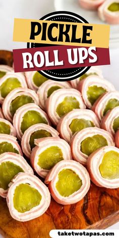 pickle roll ups on a wooden platter with the words pickle roll ups above them