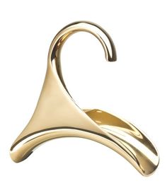 a gold object that is shaped like a cone and has a curved tail on it