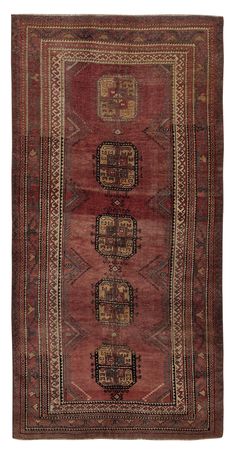 an antique persian rug with red and gold colors